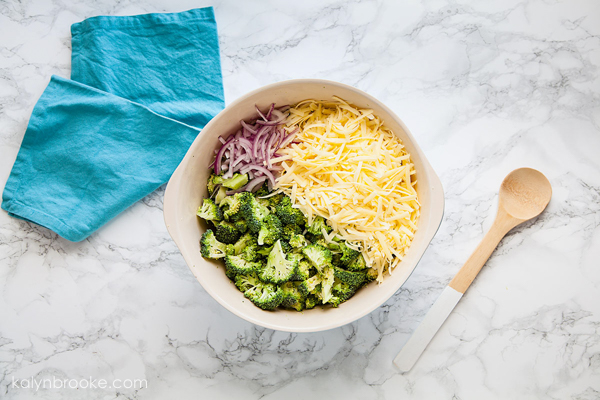 bowl of onion, cheese, and broccoli
