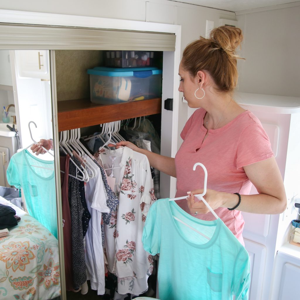 woman decluttering closet