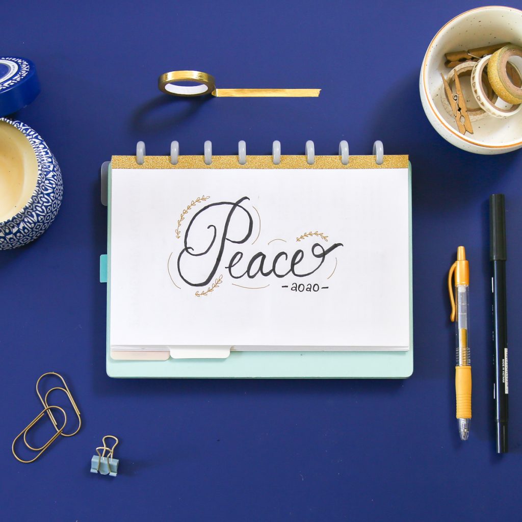 bullet journal flatlay with word of the year: peace