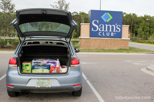 car with trunk open and groceries from Sam's Club inside